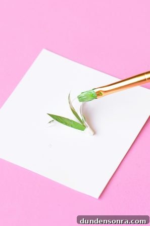 DIY Palm Springs Easter Egg Decor: Bright, Midcentury Craft Ideas 10 Someone painting paper