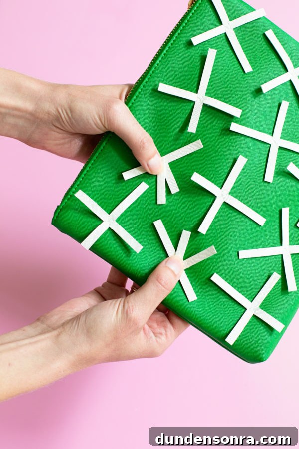Behind the Scenes: Crafting Our Cactus Clutch Handbag 8 White paper on a green bag