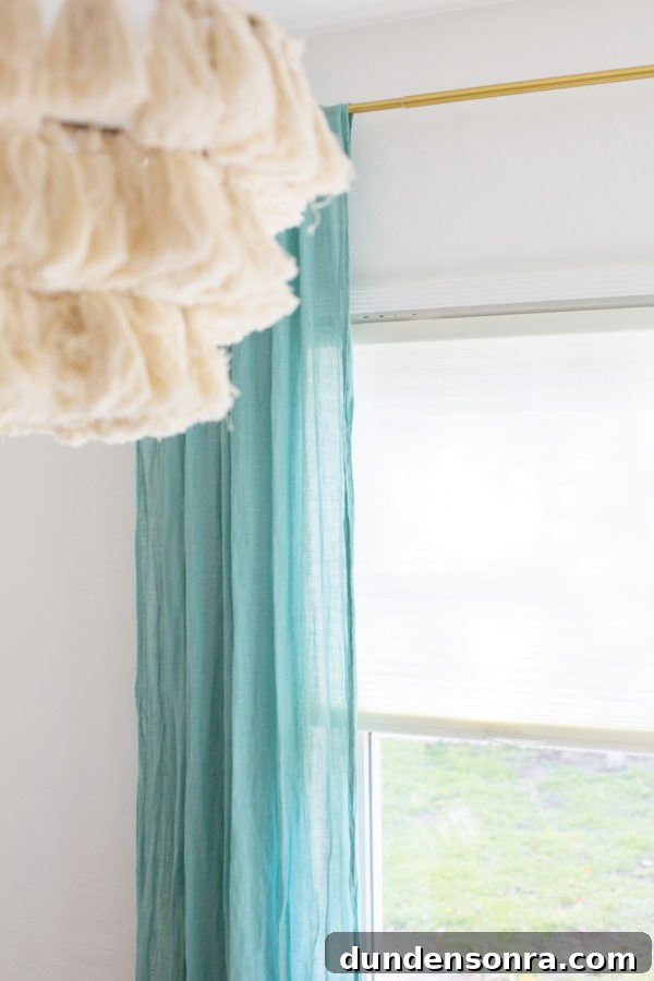 A blue curtain and a window