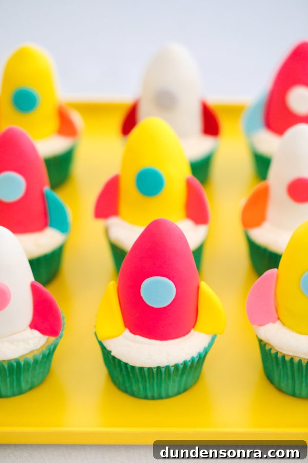 Arlo’s To Infinity and Beyond First Birthday Party Ideas 13 Cupcakes with rocketships