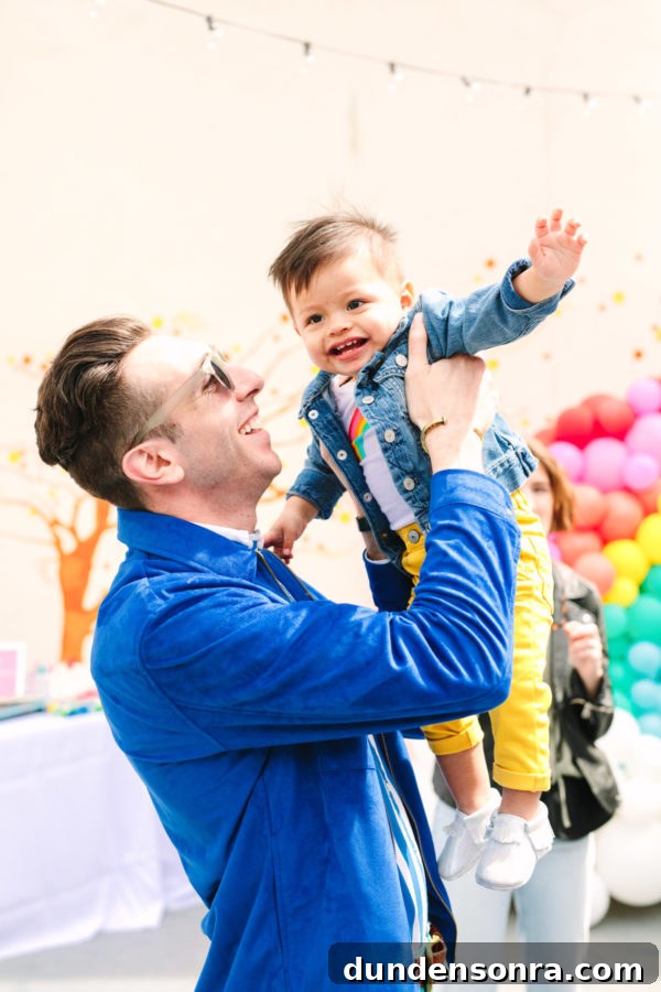 Arlo’s To Infinity and Beyond First Birthday Party Ideas 18 A man holding a little boy