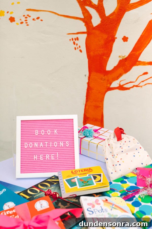 Arlo’s To Infinity and Beyond First Birthday Party Ideas 19 Pink sign next to presents