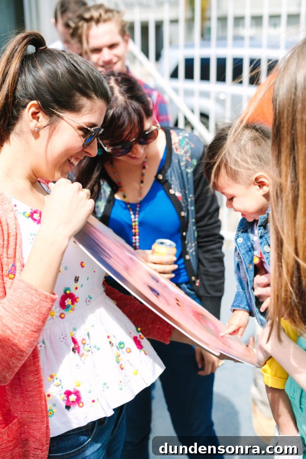 Arlo’s To Infinity and Beyond First Birthday Party Ideas 20 A group of people that are talking to each other