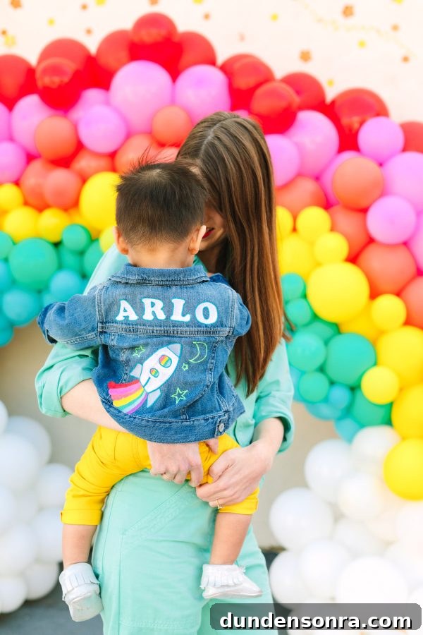 Arlo’s To Infinity and Beyond First Birthday Party Ideas 3 Rainbow balloons and people