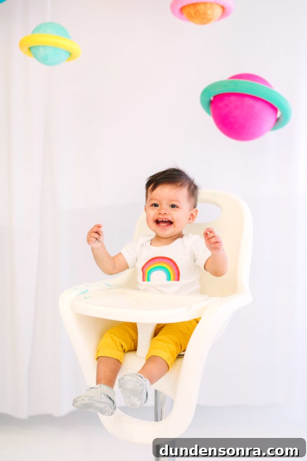 Arlo’s To Infinity and Beyond First Birthday Party Ideas 22 A little boy sitting in a chair