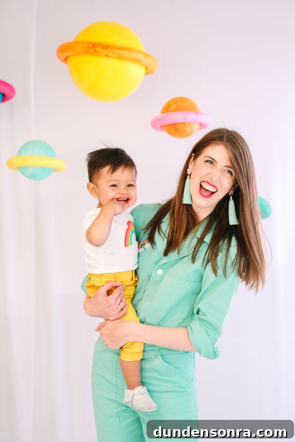Arlo’s To Infinity and Beyond First Birthday Party Ideas 23 A woman holding a little boy