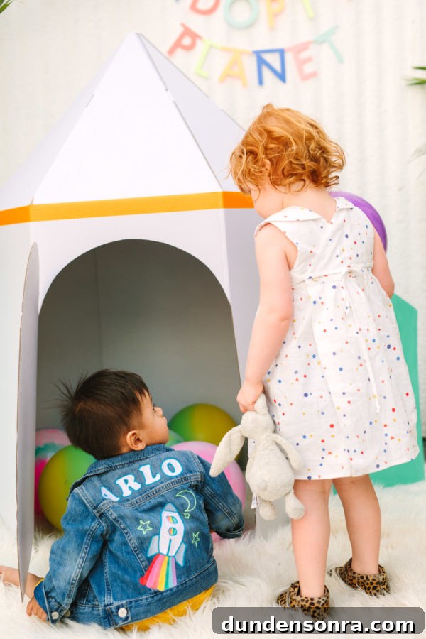 Arlo’s To Infinity and Beyond First Birthday Party Ideas 25 A little girl next to a little boy