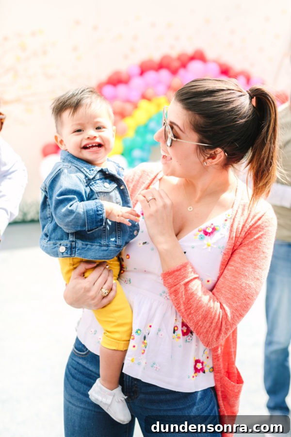 Arlo’s To Infinity and Beyond First Birthday Party Ideas 27 A woman holding a baby