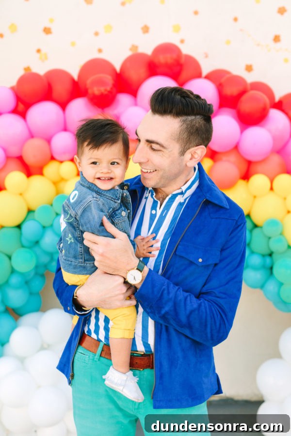 Arlo’s To Infinity and Beyond First Birthday Party Ideas 6 A man holding a little boy