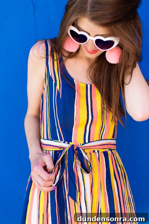 A woman wearing sunglasses posing for the camera