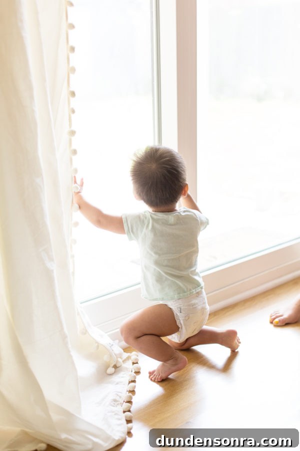 A little boy looking out a window