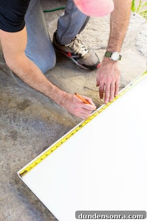 DIY Guide: Transform a Pink Closet with French Doors 6 Someone measuring something