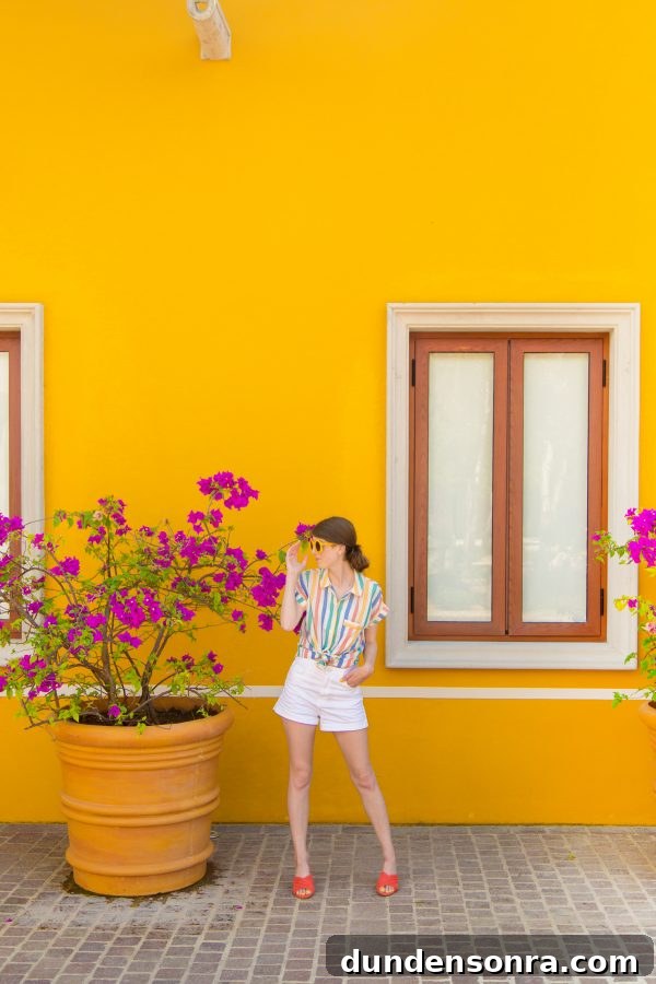 A person standing in front of a yellow wall