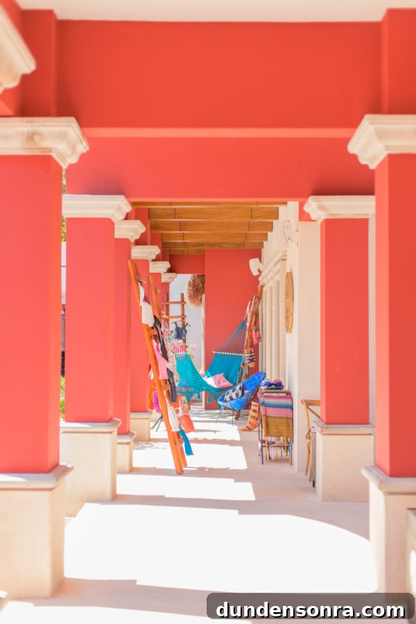A pink building with posts