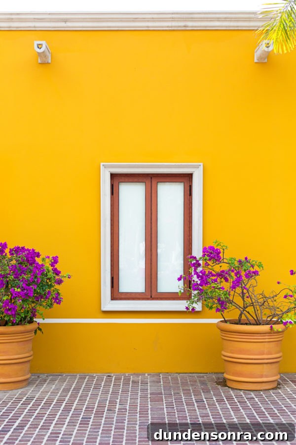 A yellow wall with a window