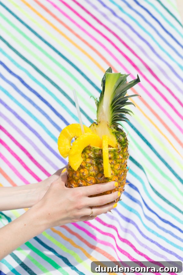 Someone holding a pineapple