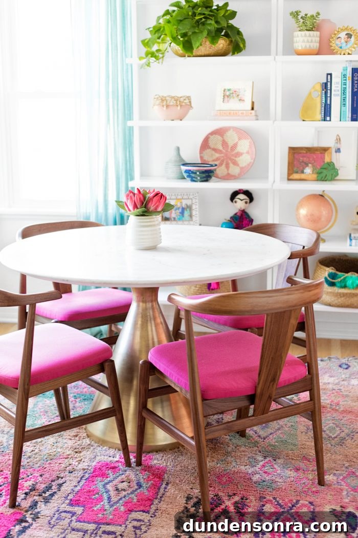 A table with pink chairs