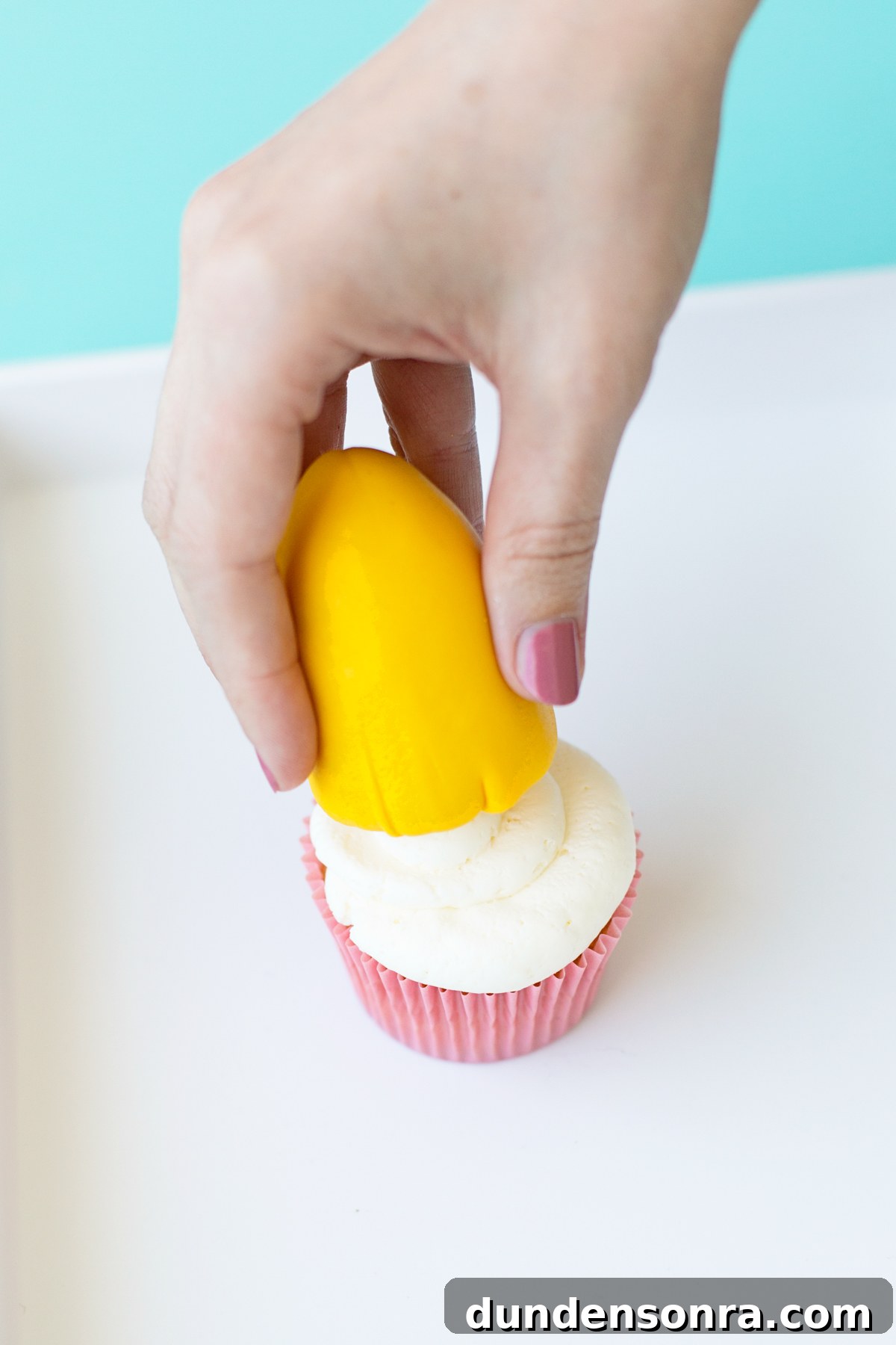 Space-Themed Cupcakes: Step-by-Step Recipe & Decorating Tips 12 Setting rocket ship on top of cupcake