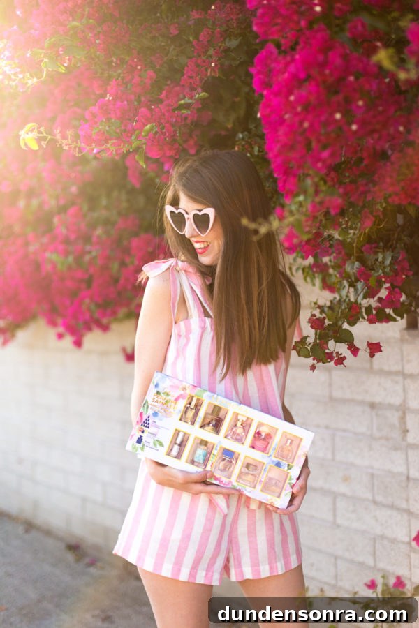 A girl standing in front of flowers