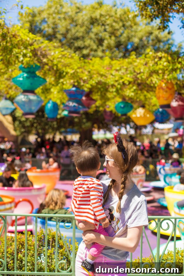 Two people standing in front of a ride