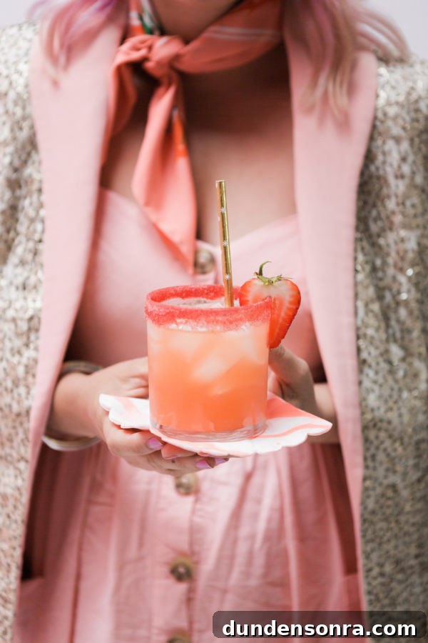 Someone holding a pink drink