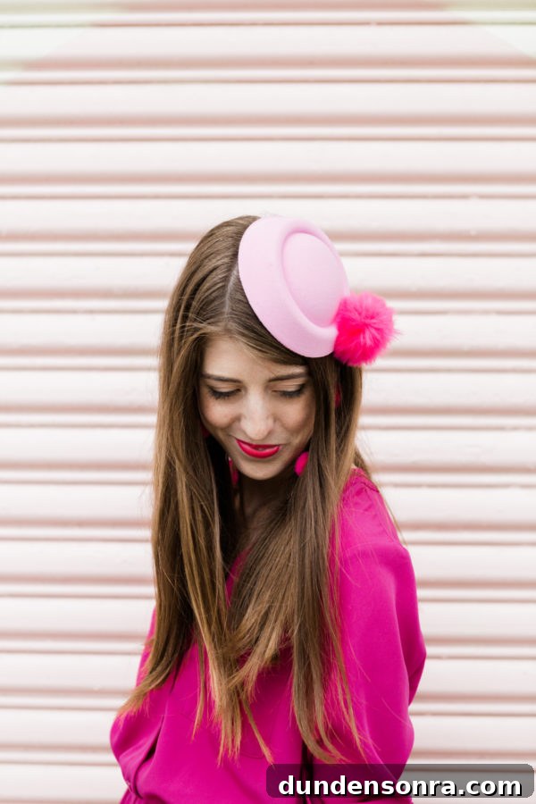 A woman wearing a pink hat