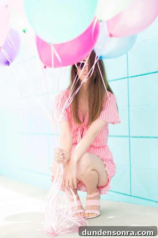 Someone holding balloons