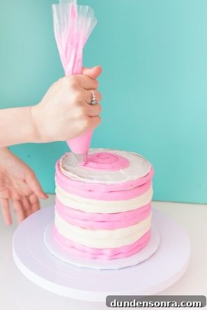A person decorating a cake