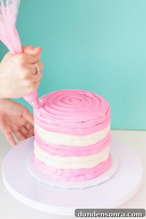 A person decorating a cake