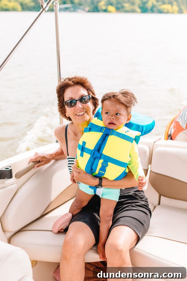 Family Lake Getaway: A Weekend of Fun, Fishing, and Relaxation 12 A small child sitting on a boat in the water