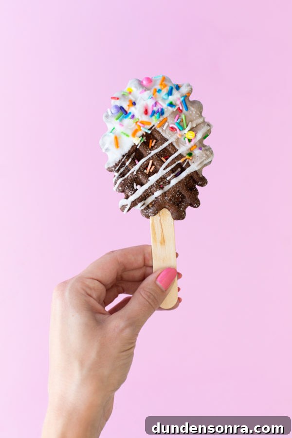 Someone holding a pretzel pop