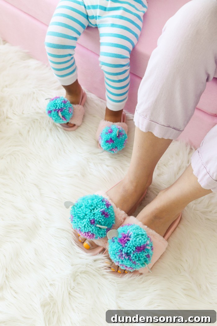 Mother and son wearing matching Monster's Inc Pom Pom slippers