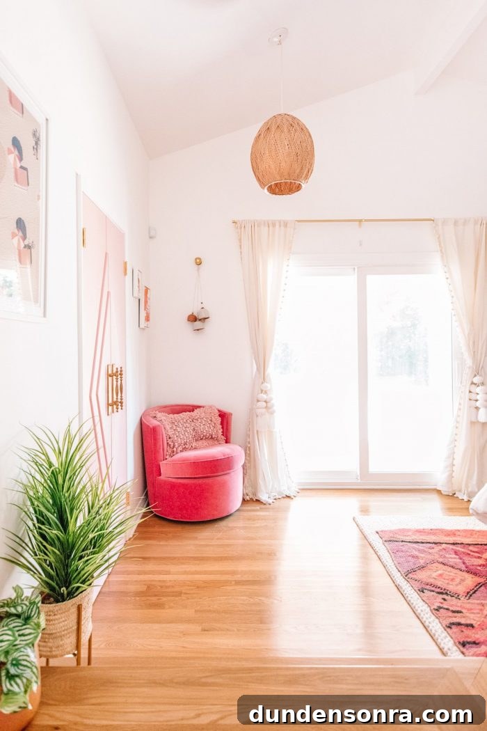 A pink chair in a corner
