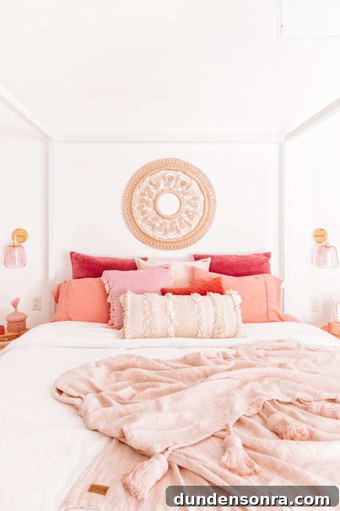 A bed with pink pillows