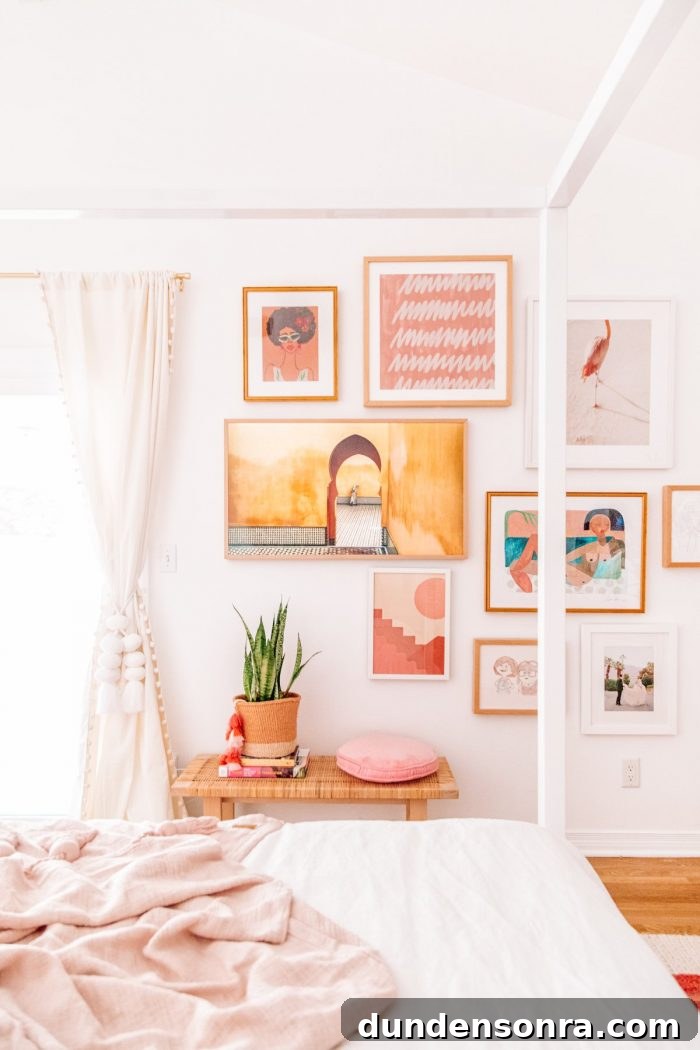 A bedroom with pink art