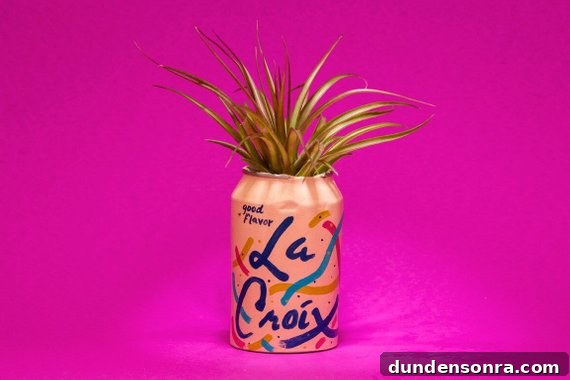 A la croix vase filled with leaves