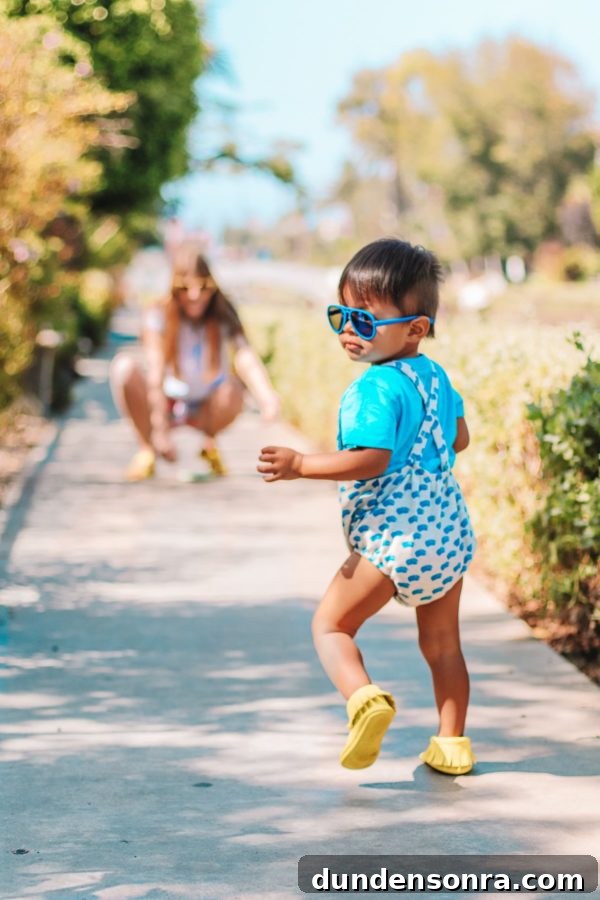 A little boy walking down a path