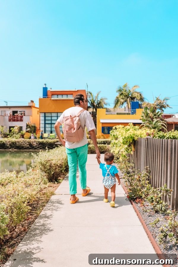 A man and a little boy walking down a path