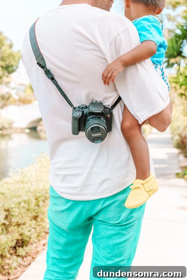 A man with a camera around him