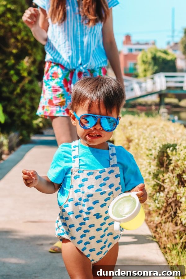A little boy wearing sunglasses