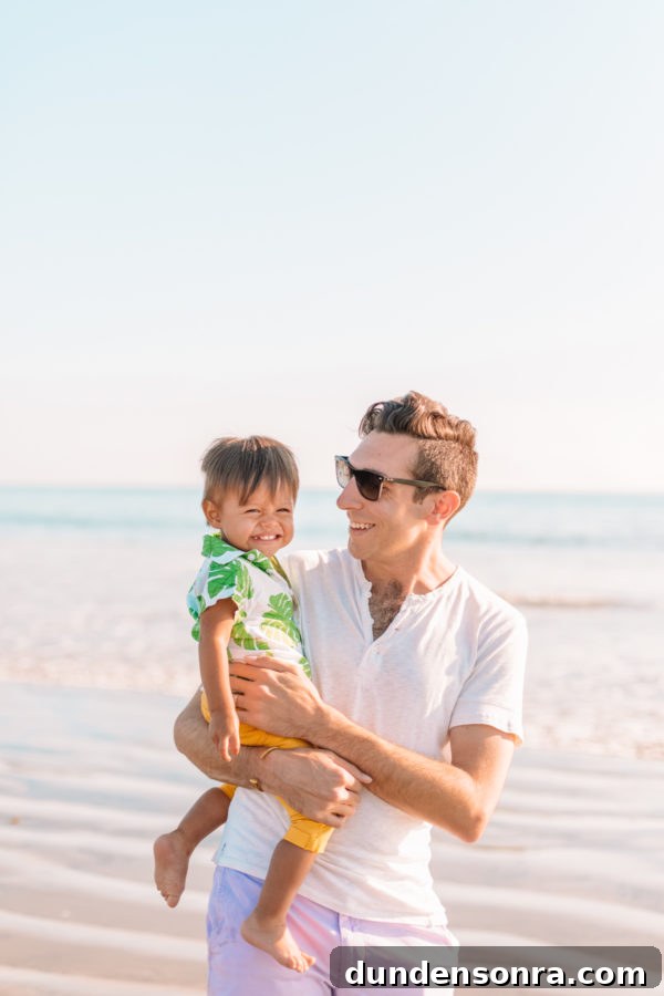 Our Family Getaway to Coronado Island: Top Things to Do 5 A man holding a a little boy on the beach