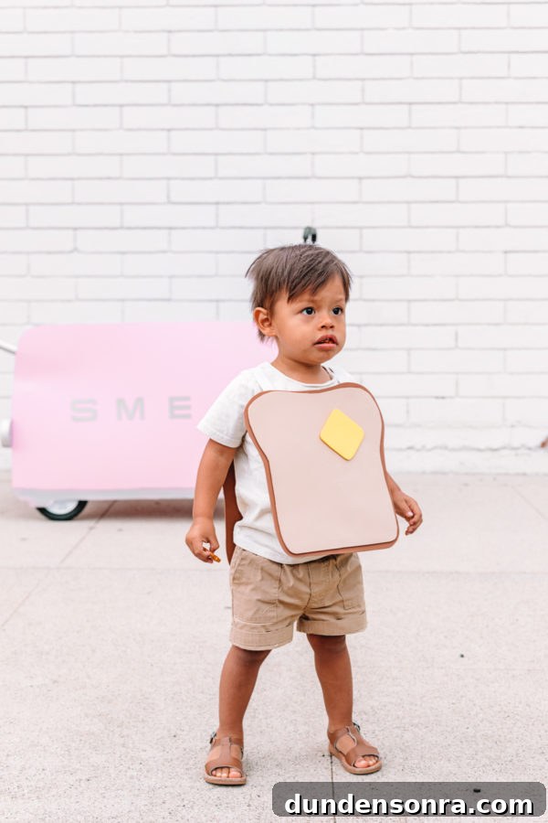A little boy dressed as toast
