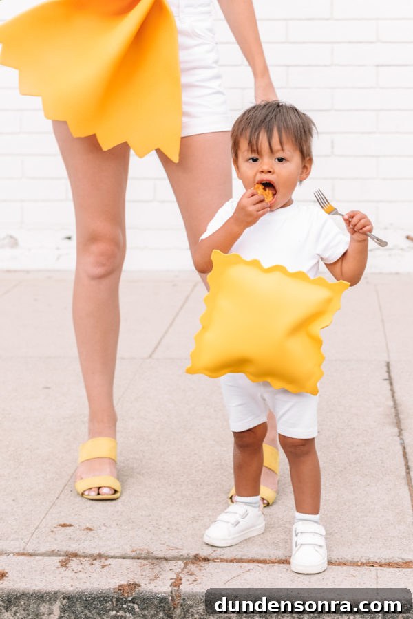 A baby dressed as pasta