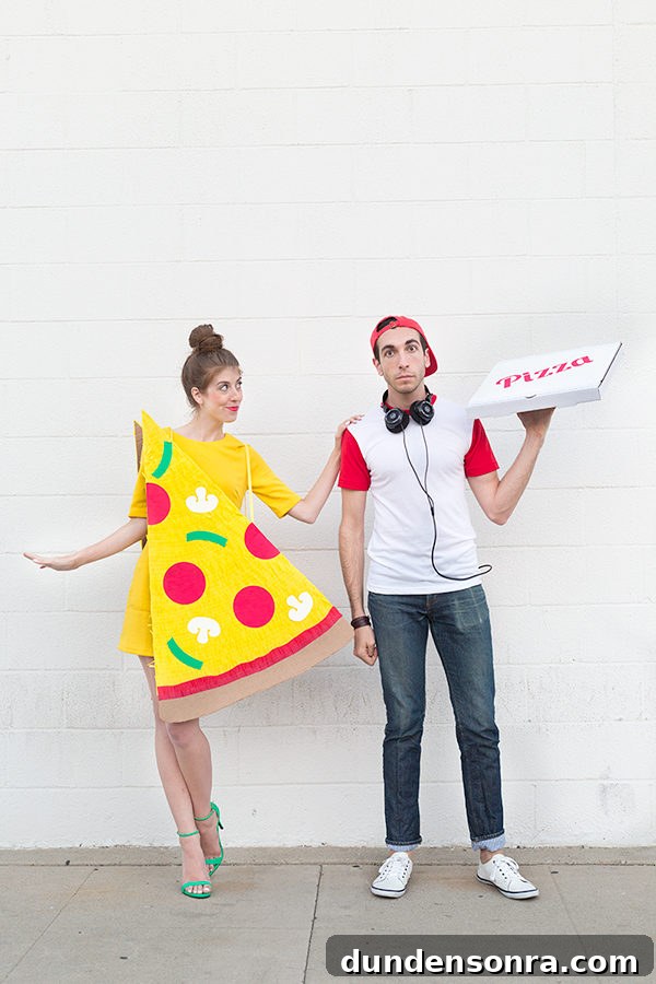 A woman dressed up as a pizza next to a man dressed up as delivery man
