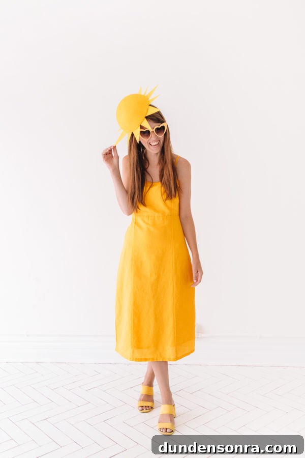 Creative DIY Weather-Themed Family Costume Ideas 17 A woman dressed as a yellow sun
