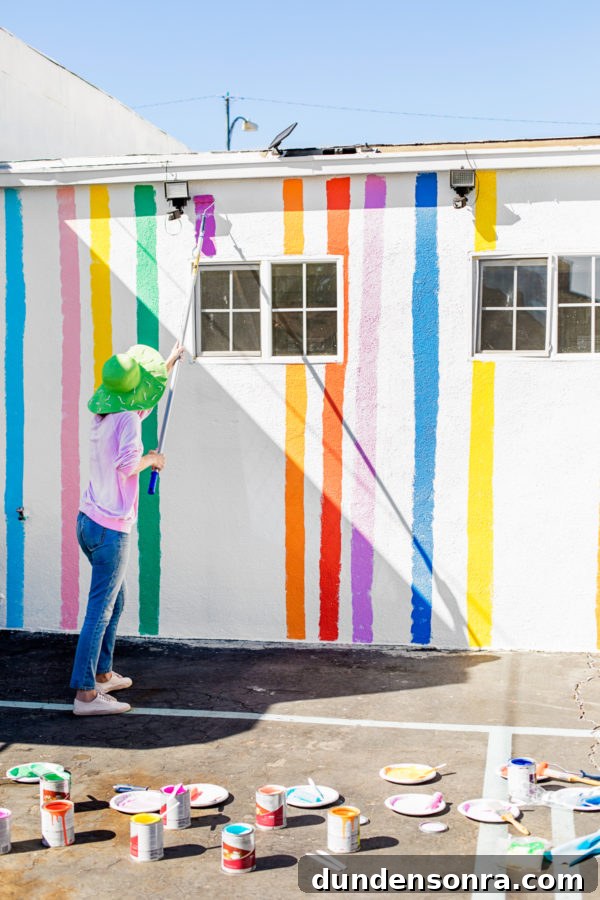 A person painting a wall