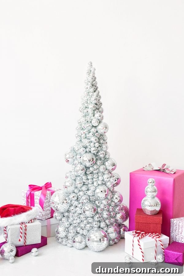 22 Festive Colorful Holiday DIYs for Bright Seasonal Decor 16 Disco ball Christmas tree