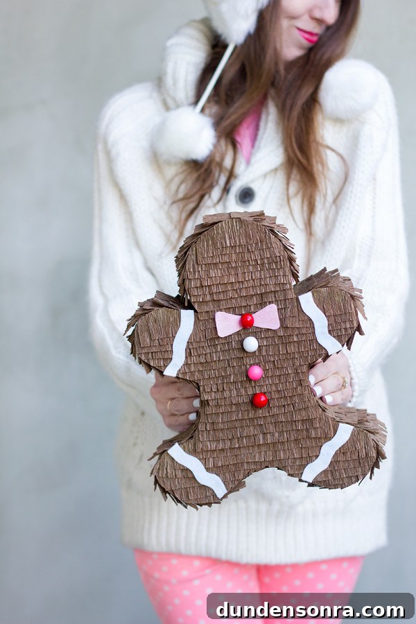 22 Festive Colorful Holiday DIYs for Bright Seasonal Decor 22 DIY Gingerbread Man Piñata