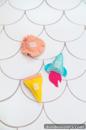DIY Felt Christmas Tree Wall Hanging Tutorial for Festive Decor 16 Felt items on the floor