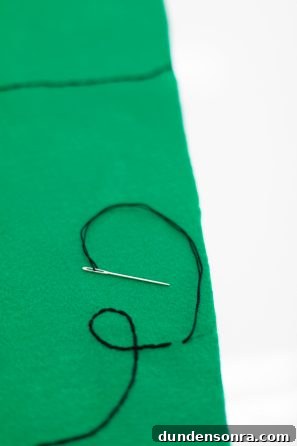 DIY Felt Christmas Tree Wall Hanging Tutorial for Festive Decor 8 Green felt and black string